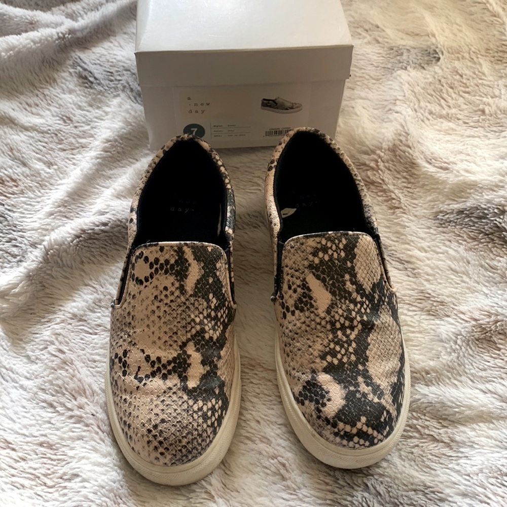Slide on sneaker style shoes. Gray snake print